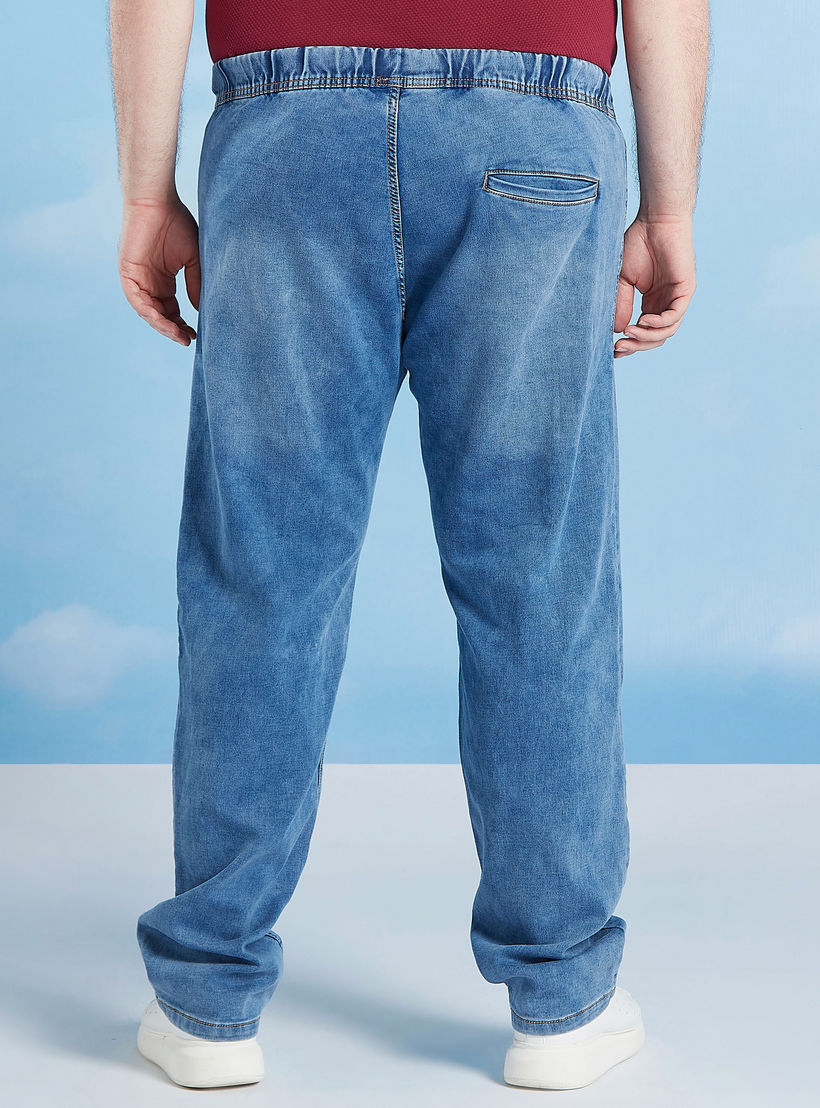 بنطلون جينز سادة بجيوب وخصر مطّاطي متوسّط الإرتفاع-men-clothing-bottoms-jeans-image-4