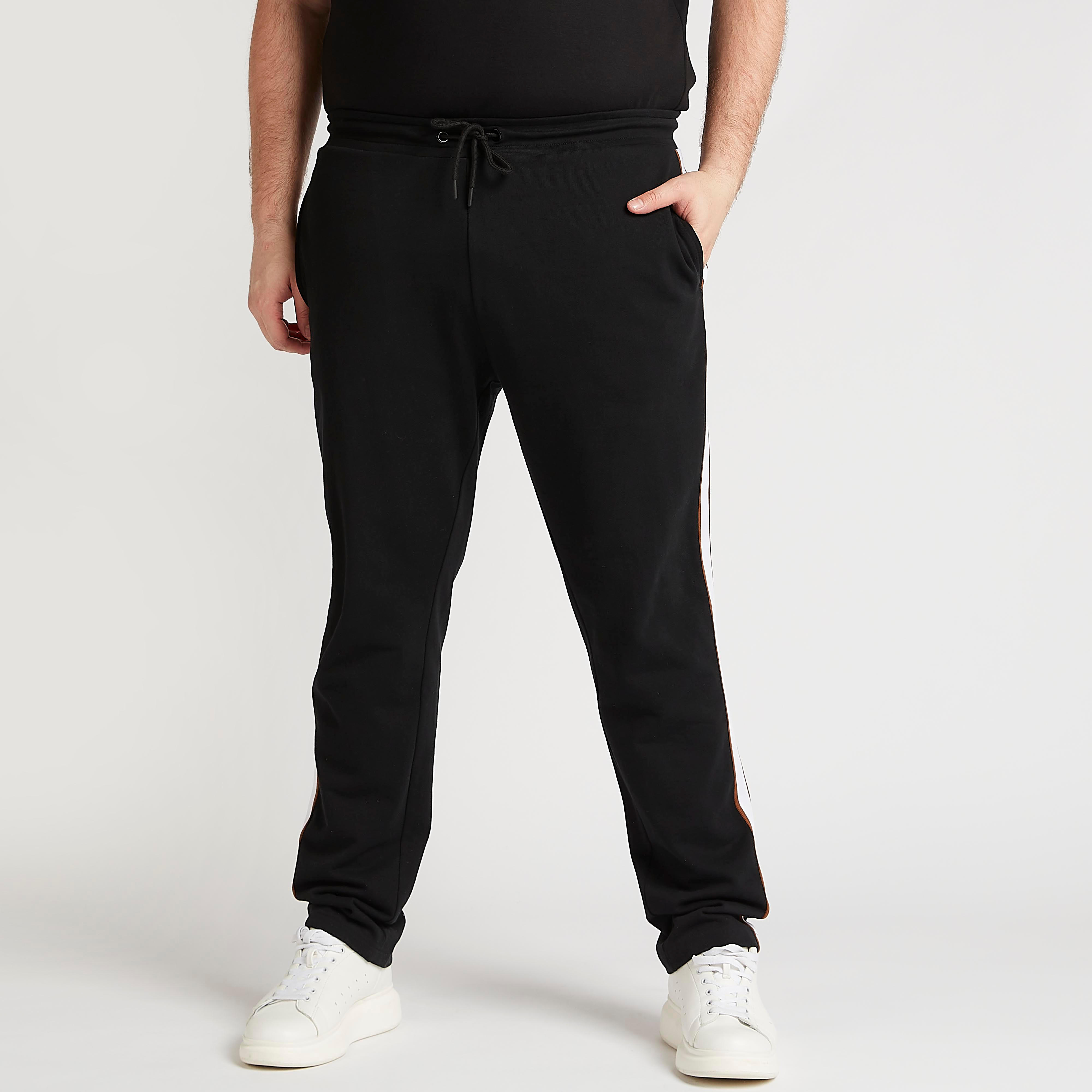 بنطلون سادة بخصر مطّاطي وتفاصيل شريطة-men-clothing-bottoms-joggers-image-1