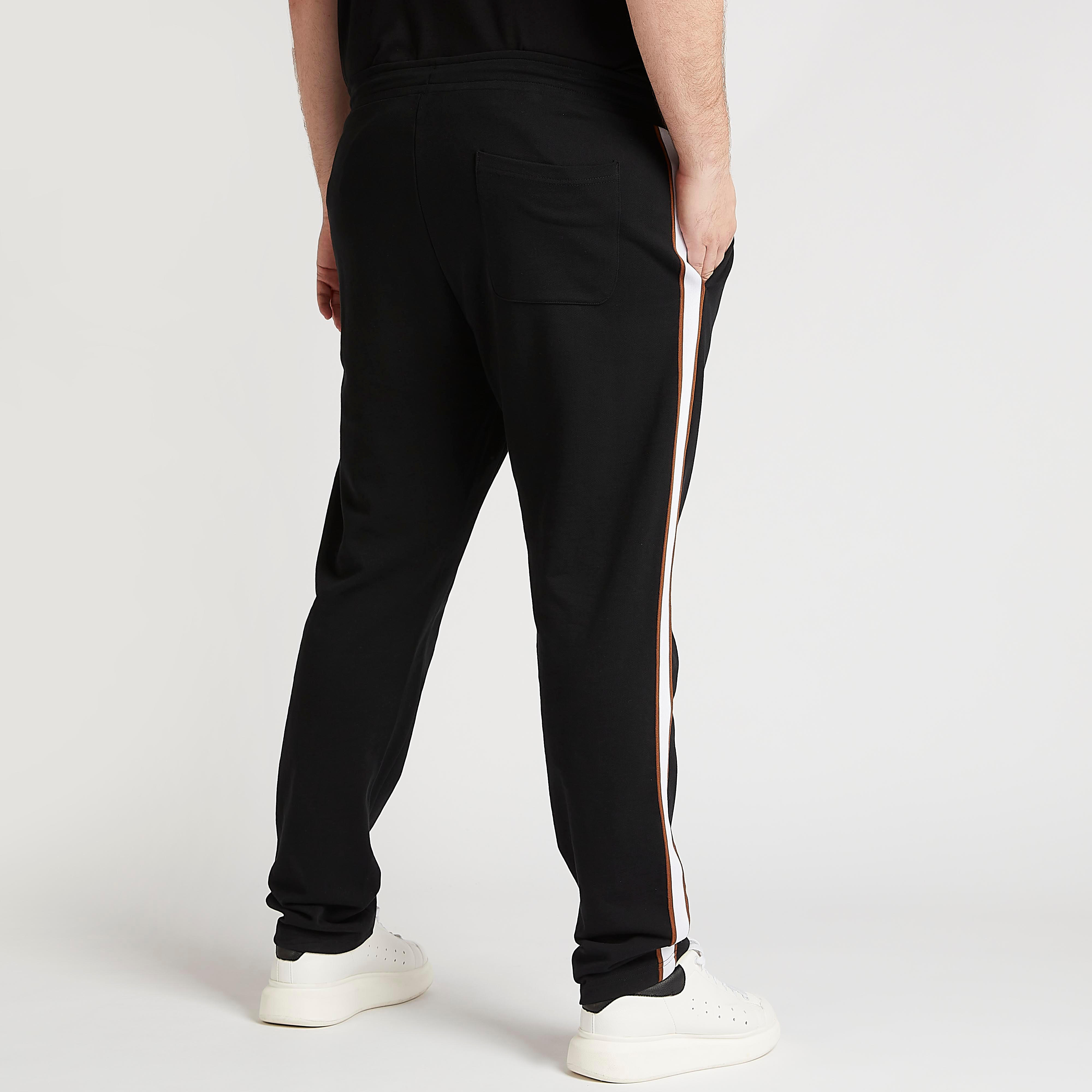 بنطلون سادة بخصر مطّاطي وتفاصيل شريطة-men-clothing-bottoms-joggers-image-4