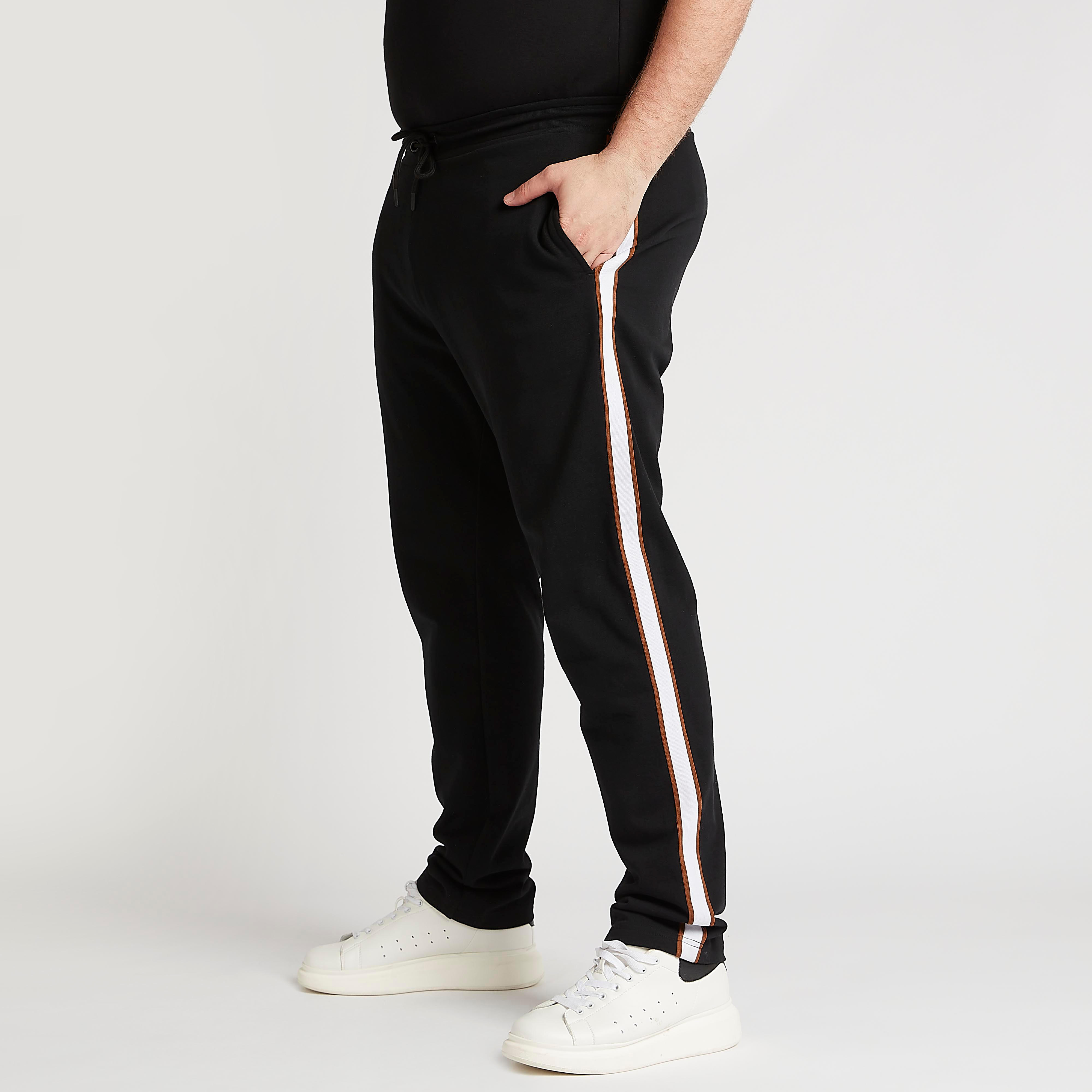 بنطلون سادة بخصر مطّاطي وتفاصيل شريطة-men-clothing-bottoms-joggers-image-5