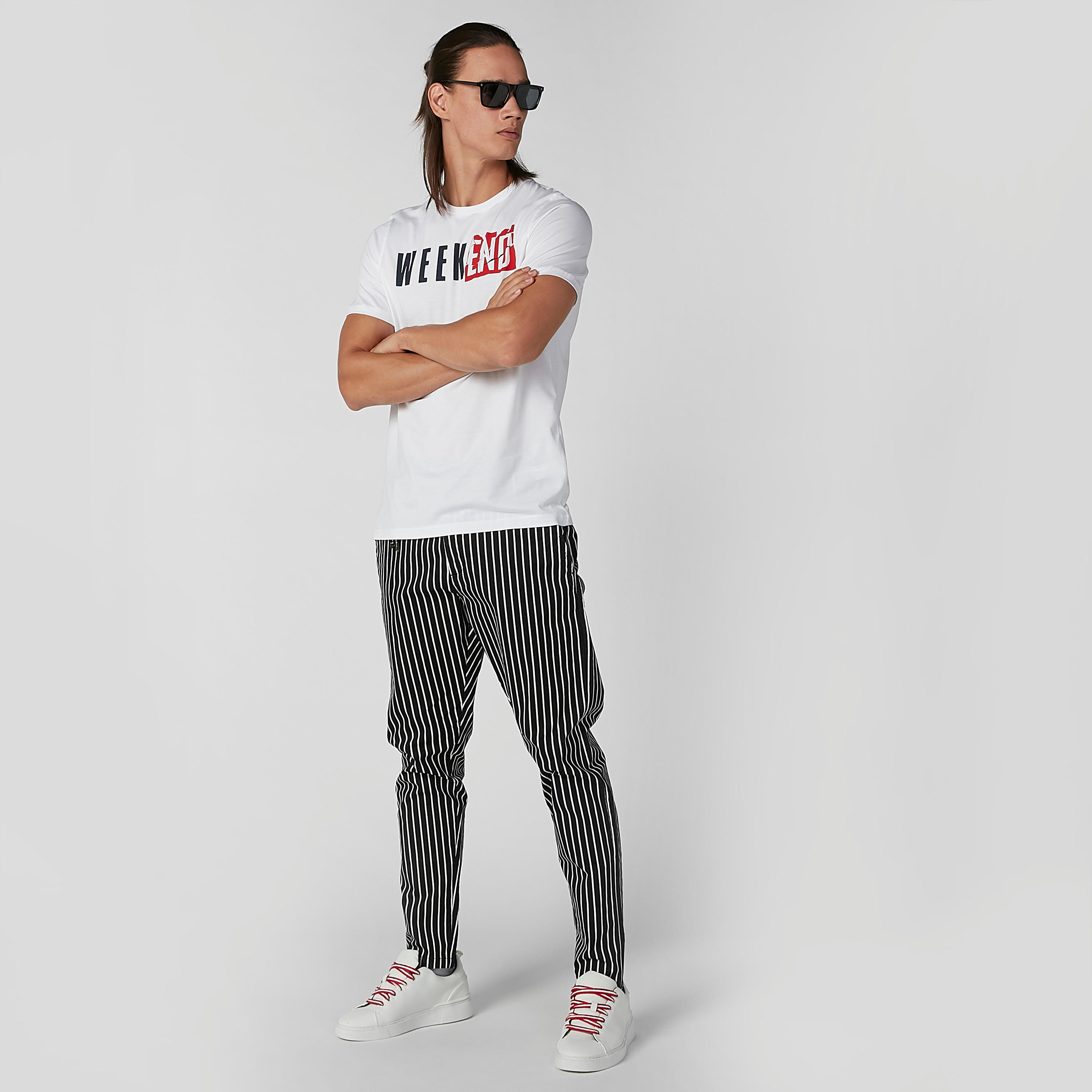 بنطال شينو مقلّم بقصة سليم وخصر متوسط الطول وجيوب جانبية-men-clothing-bottoms-trousersandchinos-trousers-image-4