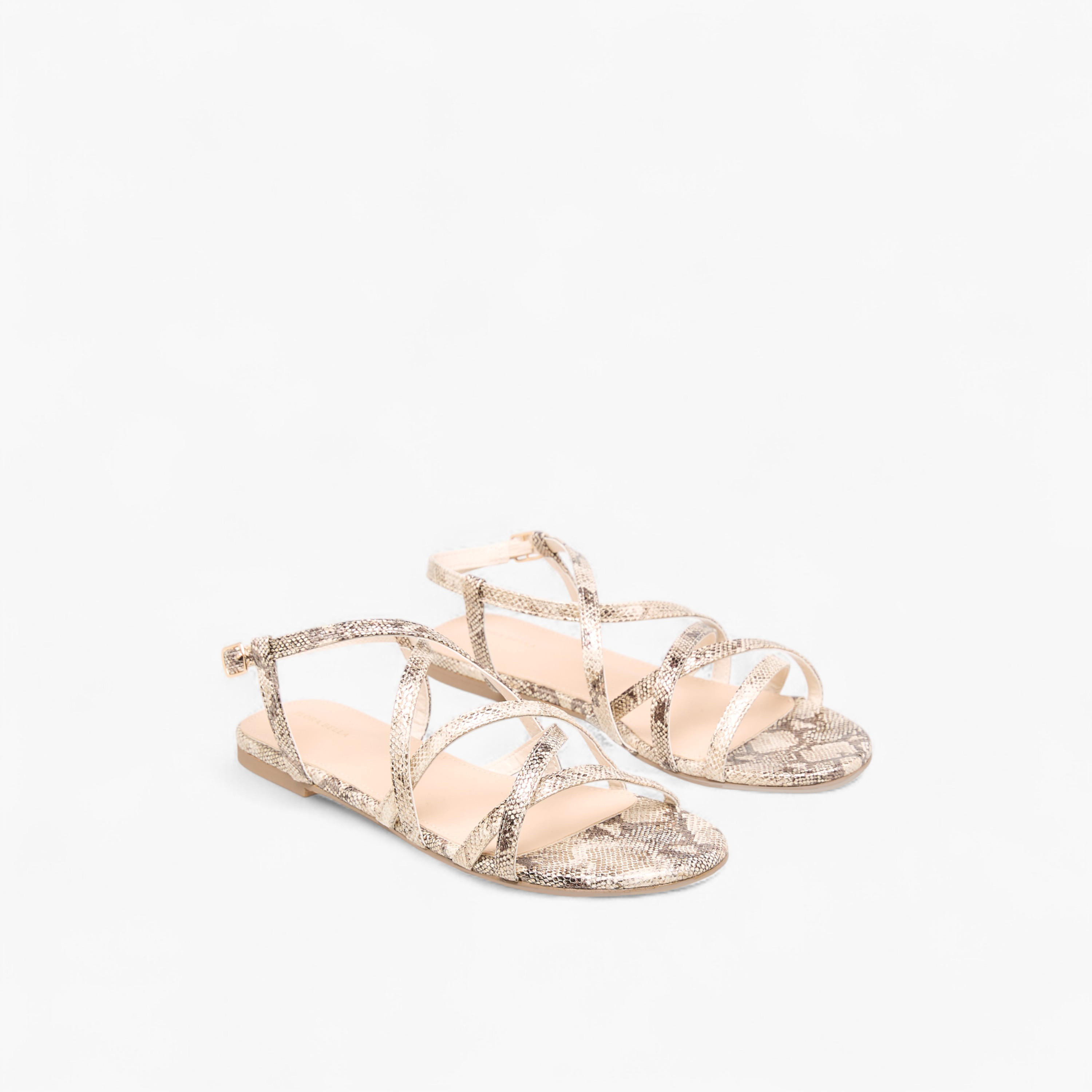 Flora Bella Animal Print Criss Cross Sandals with Buckle Closure-women-shoes-flats-sandals-image-1